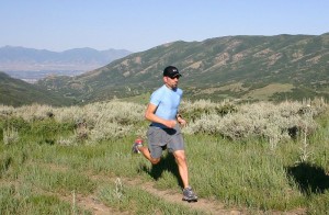 A ultramarathoner running the 32 Mile Wyoming Ultramarathon in the Bighorn Mountains